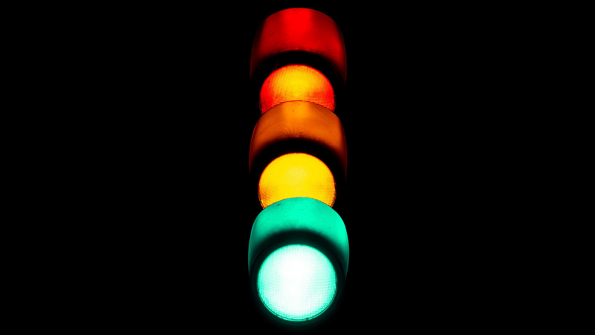 Traffic light in a black background.