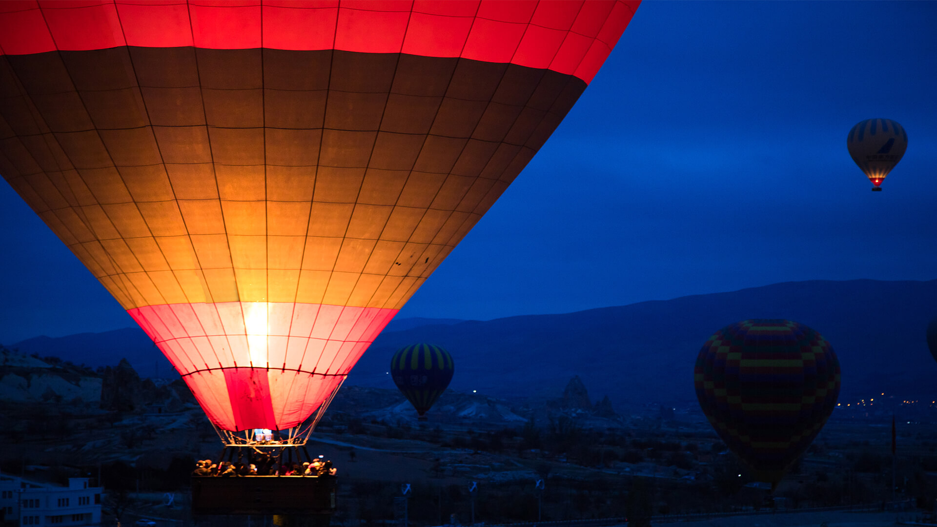 Hot air balloons at night.